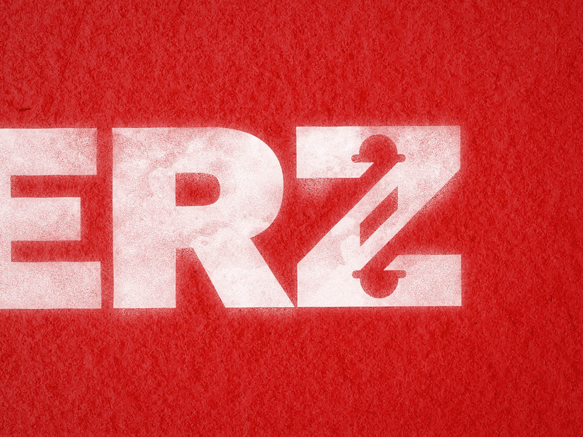 A close up of monogram Z at the end of the name BARBERZ.